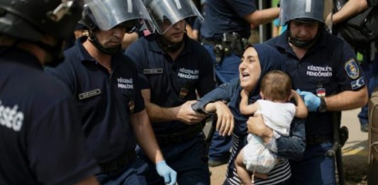 The arrest of migrants by police in Hungary
