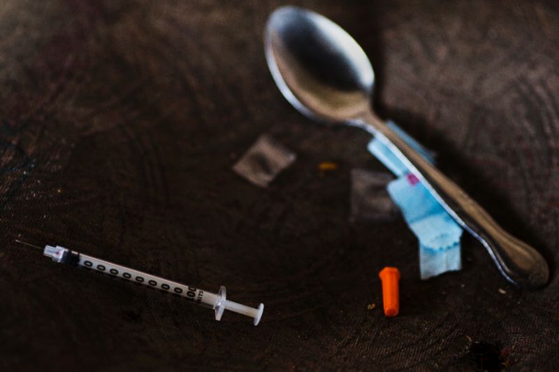 A spoon and a syringe used by an addict