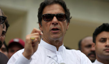 Cricket star-turned-politician Imran Khan, chairman of Pakistan Tehreek-e-Insaf (PTI), speaks to members of media after casting his vote at a polling station during the general election in Islamabad, Pakistan, July 25, 2018.