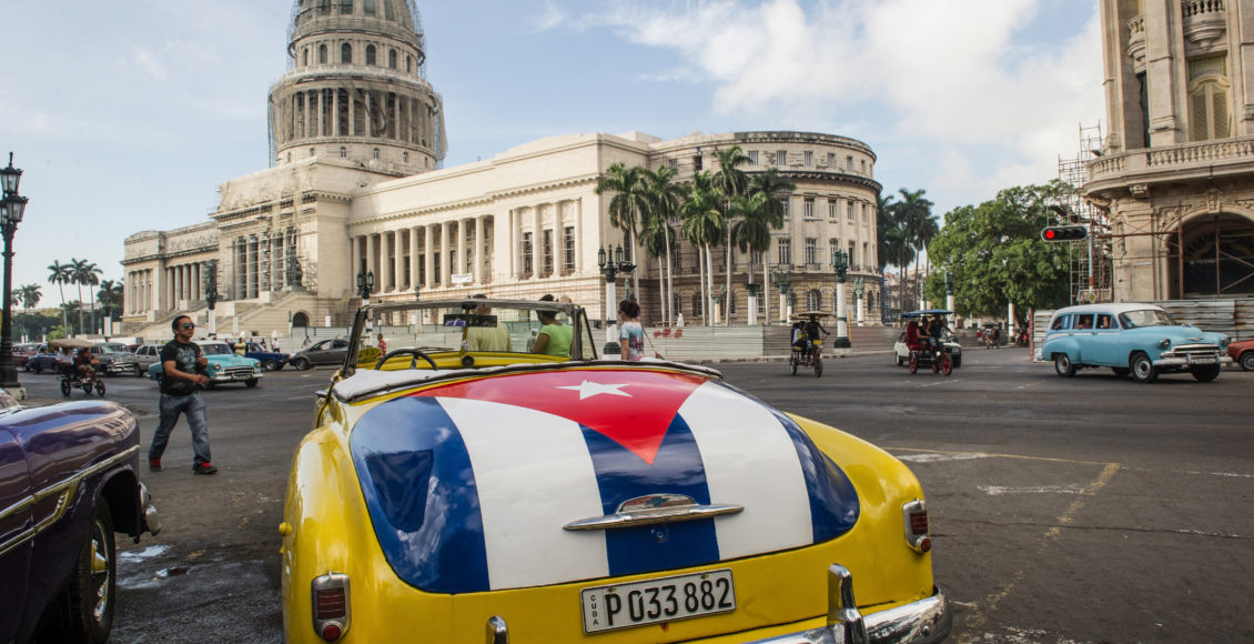 An old car with the Cuban flag painted on the trunk is seen near the Capitol of Havana in Cuba on January 7, 2015.