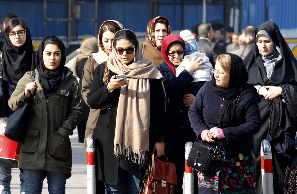 Iranian women walk down a street in the capital Tehran on February 7, 2018.