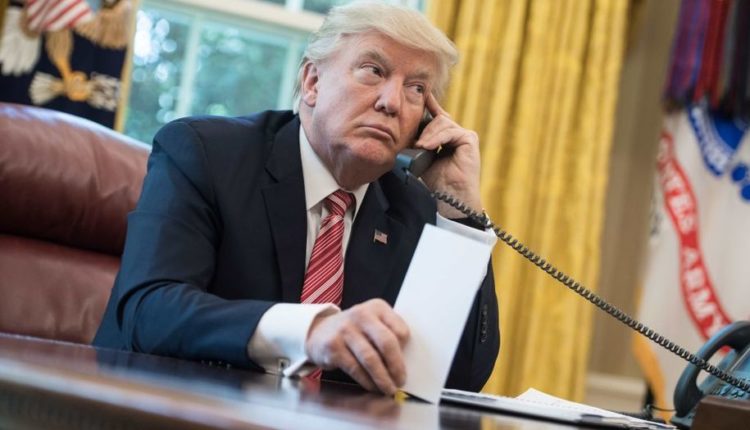 US President Donald Trump making a phone call.