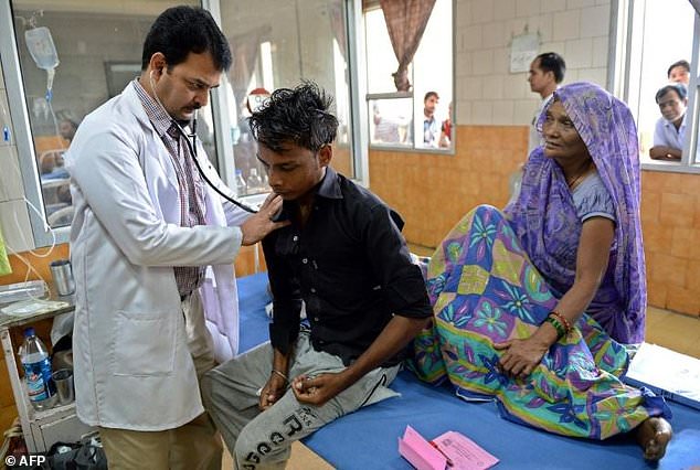 A doctor in India taking tests.