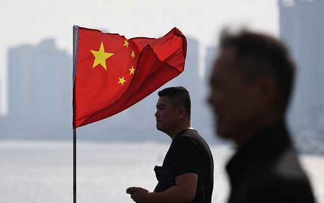 Two Chinese men and a flag