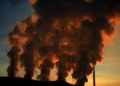 Smokes rising from stacks adding carbon dioxide (CO2) in the earth’s atmosphere and contributing to global warming and climate change.