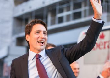 Liberal Party leader Justin Trudeau waves to supporters as he arrives for the first federal leaders debate of the 2015 Canadian election campaign on August 6, 2015 in Toronto, Canada