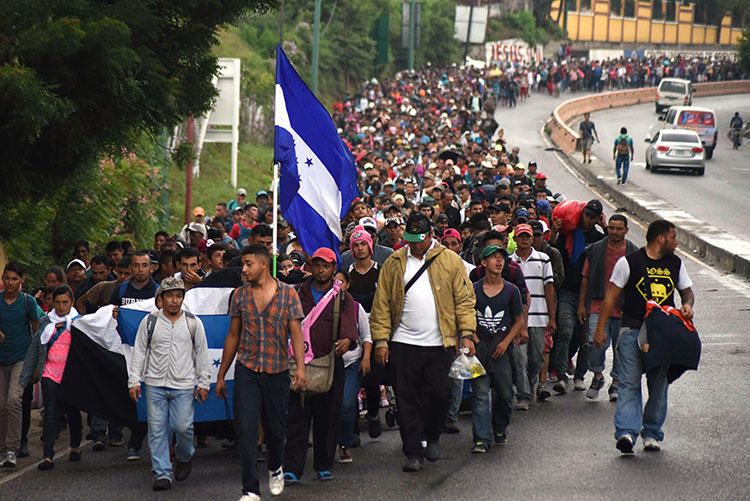 Honduran migrants take part in a caravan towards the United States in Chiquimula, Guatemala on October 17, 2018