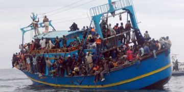 African migrants stranded on a boat coming from Libya wait for rescue services, near Sfax, on the Tunisian coast, on June 4, 2011