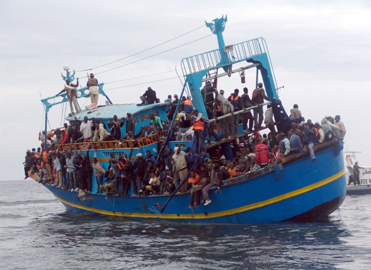 African migrants stranded on a boat coming from Libya wait for rescue services, near Sfax, on the Tunisian coast, on June 4, 2011