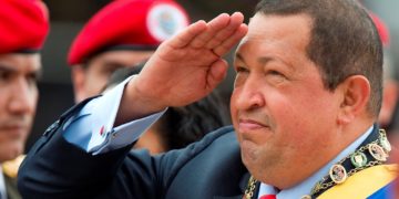 Venezuelan President Hugo Chavez salutes during a military parade to commemorate the 20th anniversary of his failed coup attempt, on February 4, 2012, in Caracas