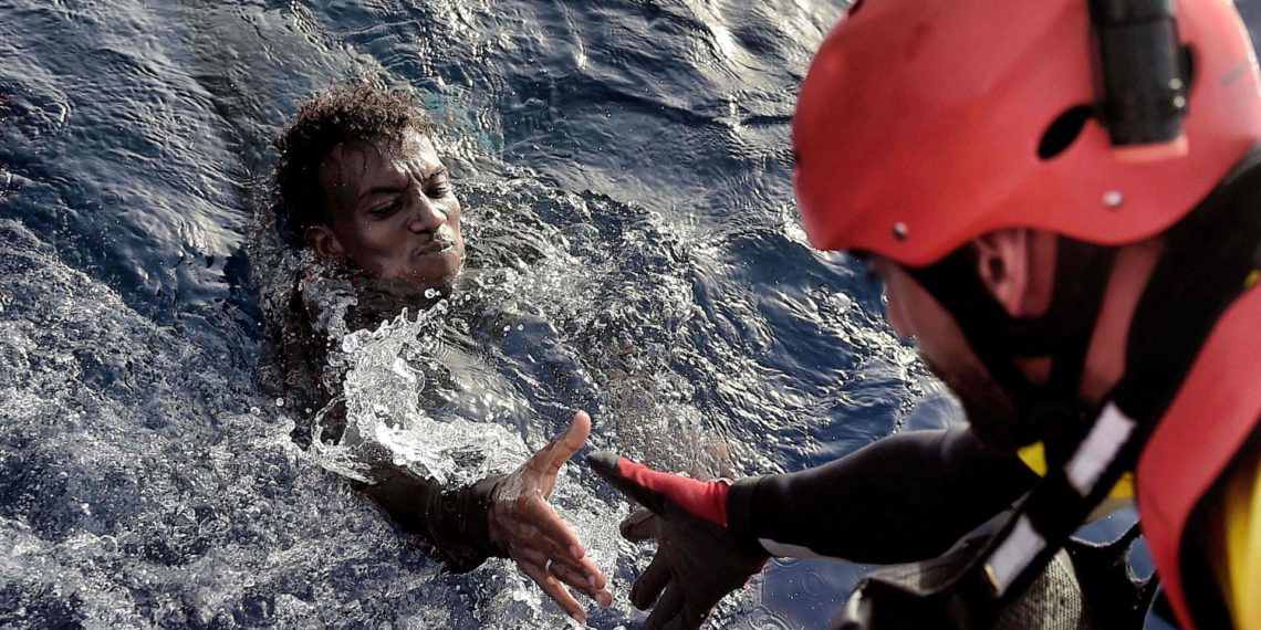 An African migrant is rescued from the Mediterranean sea