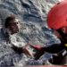 An African migrant is rescued from the Mediterranean sea