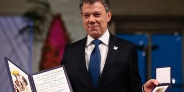 Nobel Peace Prize laureate Colombian President Juan Manuel Santos poses with the medal and diploma during the award ceremony of the Nobel Peace Prize in Oslo, Norway