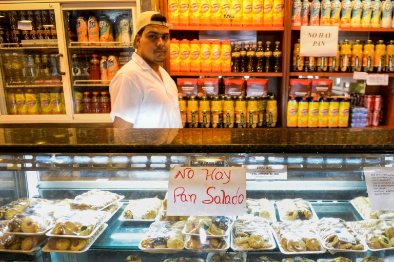 A sign reading "No Bread" is displayed at a bakery in Caracas, an increasingly common sight at Venezuelan bakeries