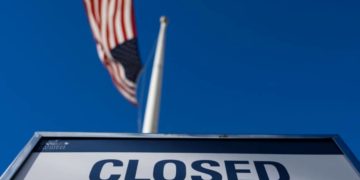 A sign is displayed on a government building that is closed because of the US government shutdown in Washington