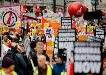 Protesters in London wearing symbolic yellow vests