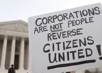 A protestor outside of the Supreme Court demonstrating against the Citizens United decision.