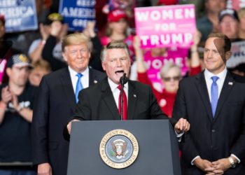 Republican Congressional Candidate Mark Harris speaking in front of President Donald Trump at a rally.