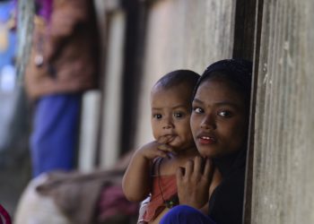 Myanmar Rohingya refugees look on in a refugee camp in Teknaf, in Bangladesh's Cox's Bazar, on November 26, 2016