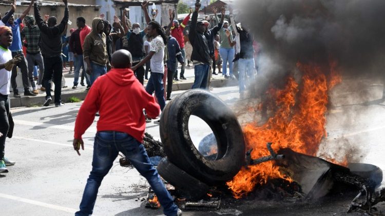 South African burning tires in protests that led to xenophobic violence