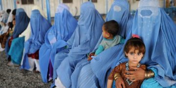 Women in Afghanistan wearing a blue burqa