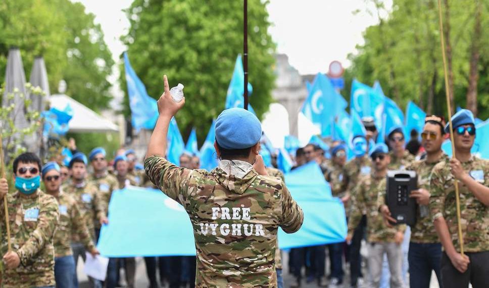 Ethnic Uyghurs take part in a protest march asking for the European Union to call upon China to respect human rights in the Chinese Xinjiang region and asking for the closure of "re-education centers."