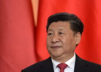 Chinese President Xi Jinping listens to a speech