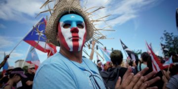 Protestor in Puerto Rico, where the nation angry over corruption and the release of insulting text chats