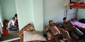 Iranian laborers rest in a hostel in Iraqi Kurdistan.