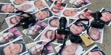 Cameras and photos of journalists killed across Mexico are placed on the ground during a protest on May 15, 2017, in Mexico City