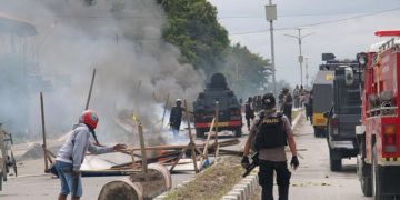 Indonesian officials confront protesters in Timika city in the restive Papua province