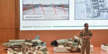 Saudi defence ministry spokesman Turki bin Saleh al-Malki displays pieces of what he said were Iranian cruise missiles and drones recovered from the attack site that targeted Saudi Aramco's facilities