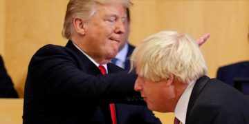 US President Donald Trump pats Boris Johnson, then foreign secretary, on the back as they participate in a session on reforming the United Nations