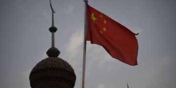 The Chinese flag flies over a mosque in Kashgar, Xinjiang