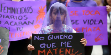 A girl participating in an International Women's Day protest in Mexico City in 2017 holds up a poster reading 'No quiero que me maten.' ('I don't want to be killed.')