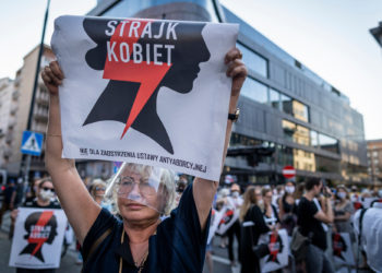 Protesters hold banners reading "Women's Strike" as they take part in protest against the Polish government plans to withdraw from the Istanbul Convention on prevention and combatting of home violence, in Warsaw, Poland on July 24, 2020.