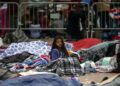 Central American migrants traveling in the "Migrant Via Crucis" caravan sleep outside "El Chaparral" port of entry to the US.