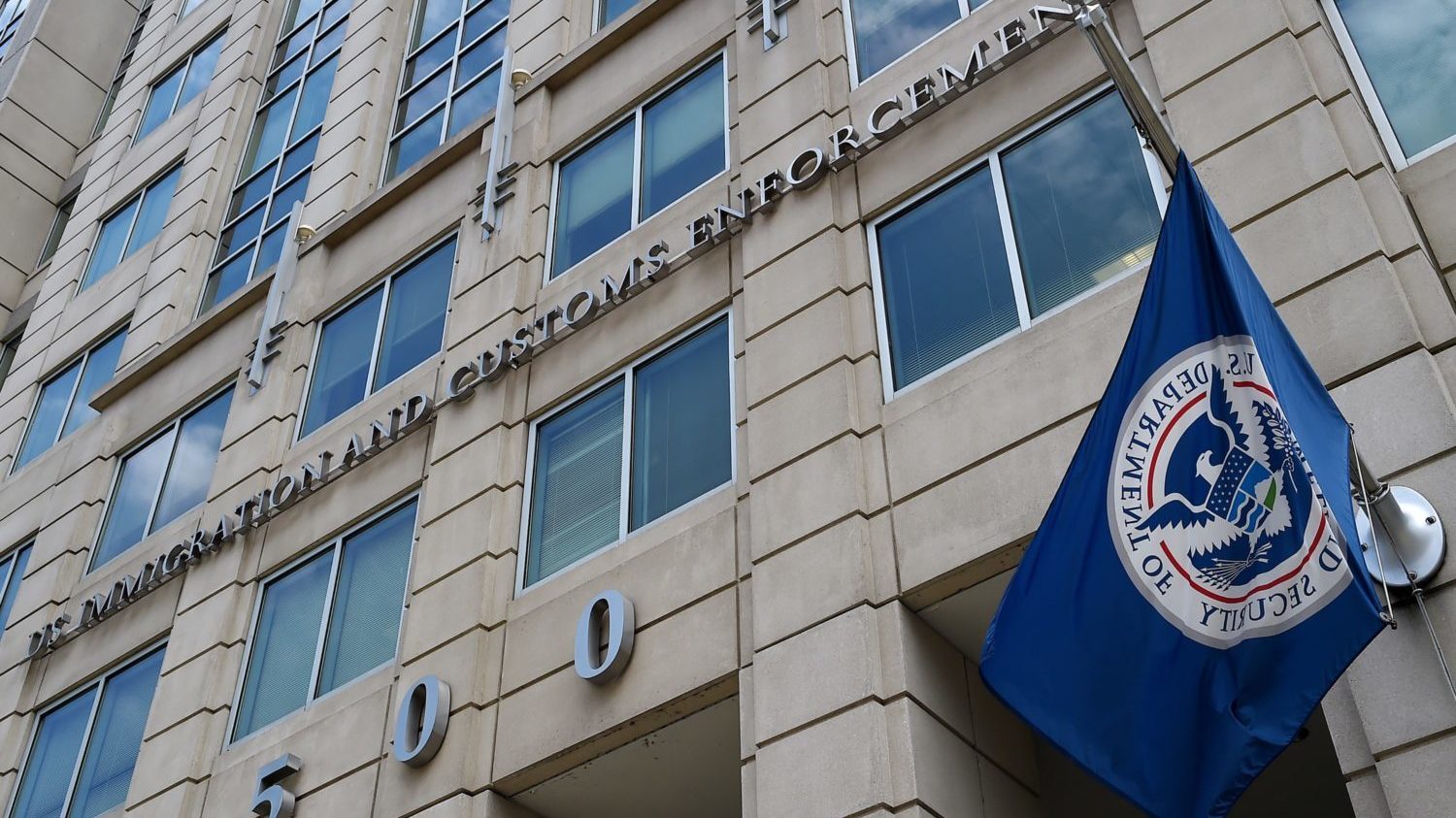 The Department of Homeland Security flag flies outside the Immigration and Customs Enforcement (ICE) headquarters in Washington, DC. 