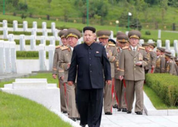 Kim Jong-un, leader of North Korea, walking with soldiers.