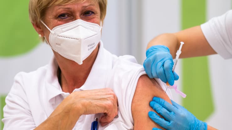 Medical personnel is given the Pfizer-Biontech Covid-19 corona virus vaccine at the Favoriten Clinic in Vienna, Austria, on December 27, 2020