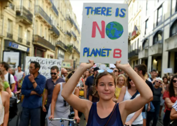 People march against climate change in Bordeaux, southwestern France, on October 13, 2018.