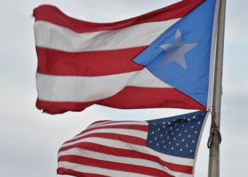 Puerto Rican and American flags flutter in the Old Town district of San Juan. Photo: Paul J. Richards/AFP