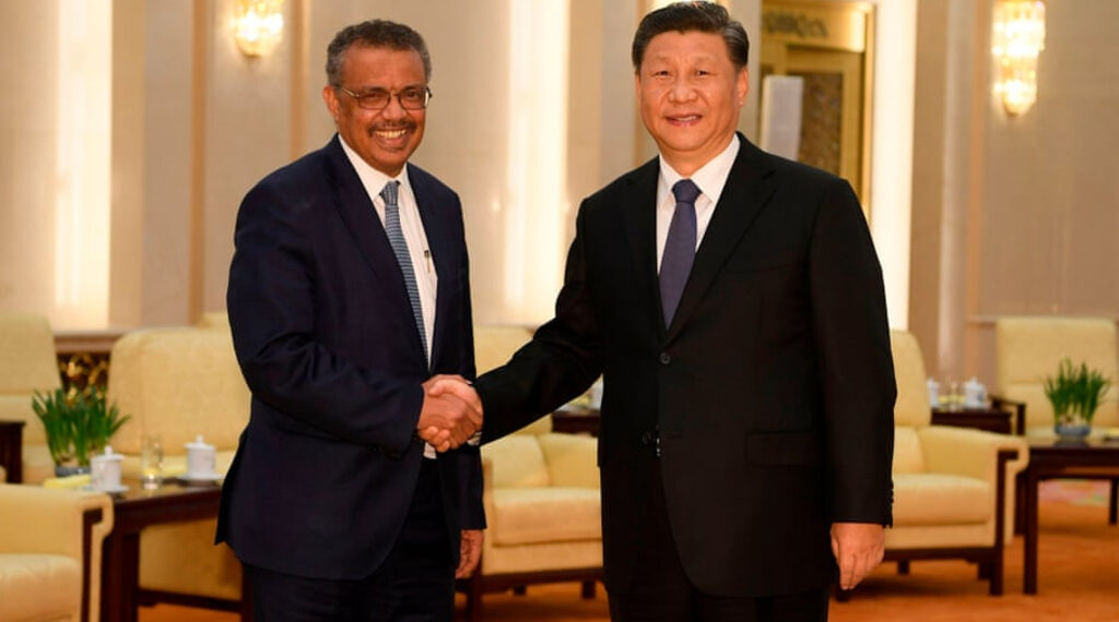 WHO director-general Adhanom Ghebreyesus shakes hands with Chinese President Xi Jinping in Beijing, January 28 2020.