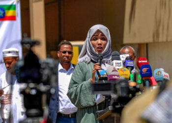 Members representing African communities in Yemen speak outside the offices of the International Organization for Migration in Sanaa, following last weekend’s fire in a holding facility, March 14, 2021.