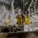 Pasadena firefighters clean the debris of a burned home on January 10, 2025.